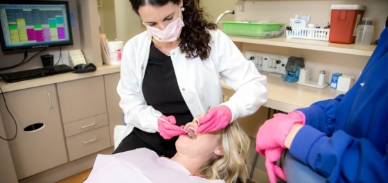 Dentist Providing Cosmetic Dentistry Treatment in Fayetteville to a Patient